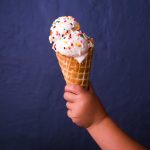 toddler holding an ice cream